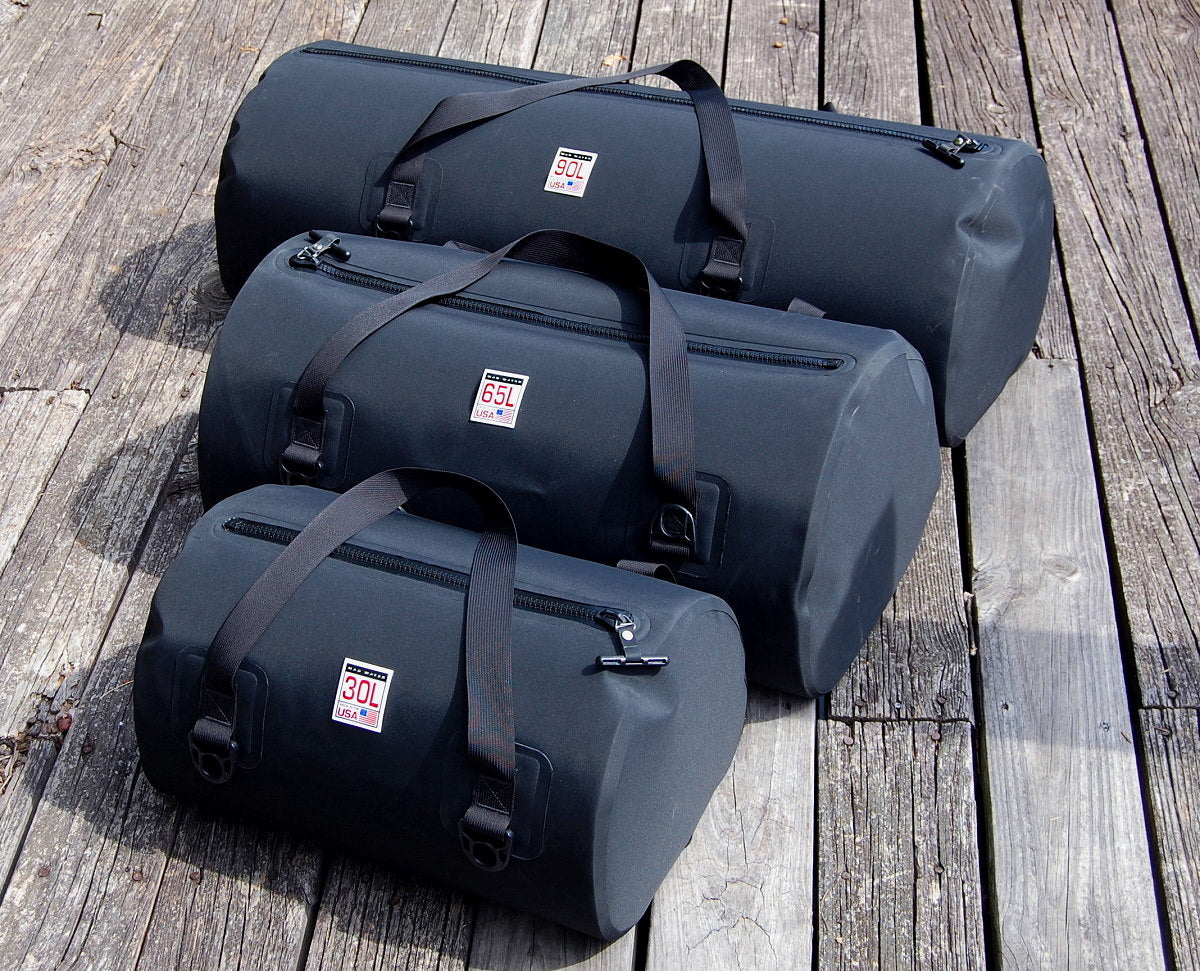 90L Waterproof USA Duffel next to 30L and 65L sizes